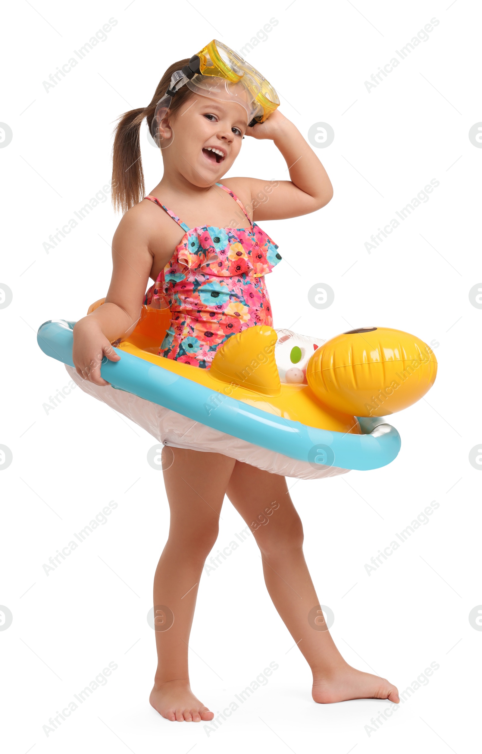 Photo of Cute little girl in swimsuit with inflatable ring on white background