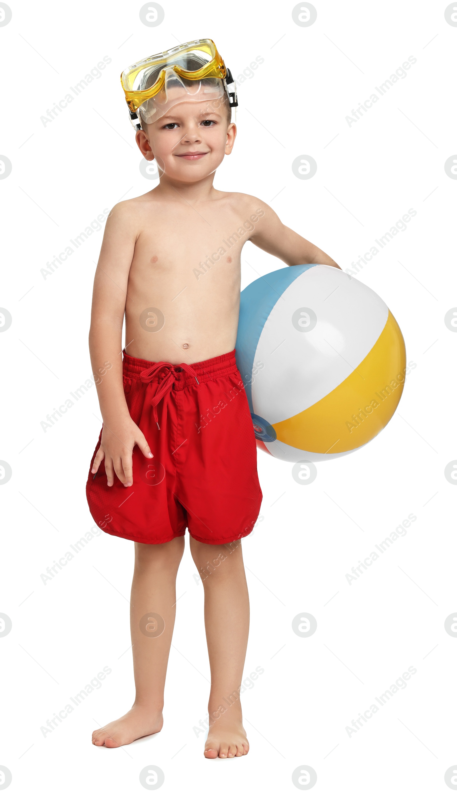 Photo of Cute little boy in beachwear with inflatable ball and mask on white background