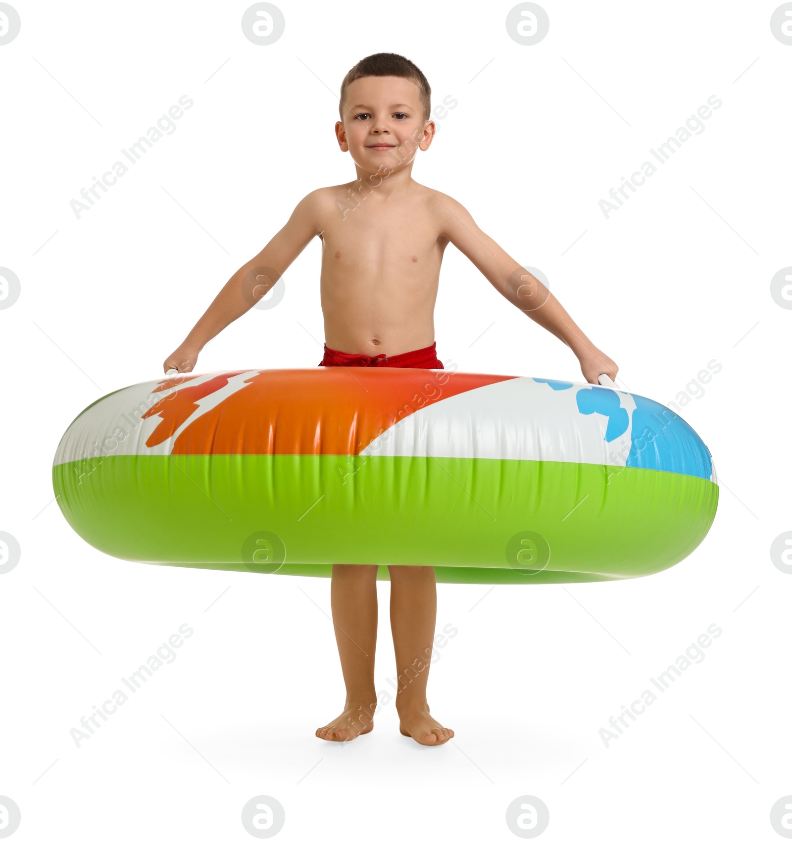 Photo of Cute little boy in beachwear with inflatable ring on white background