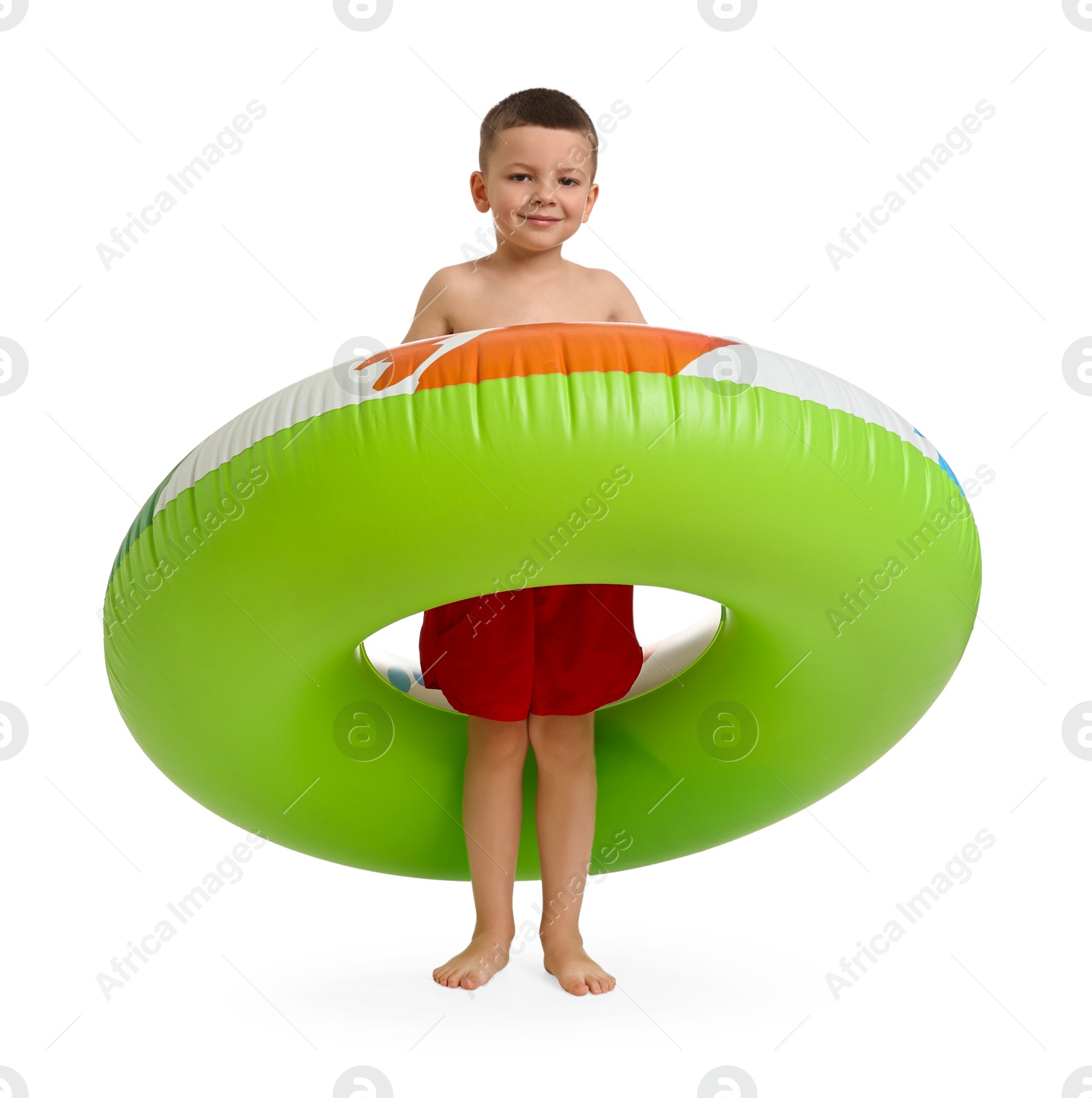 Photo of Cute little boy in beachwear with inflatable ring on white background