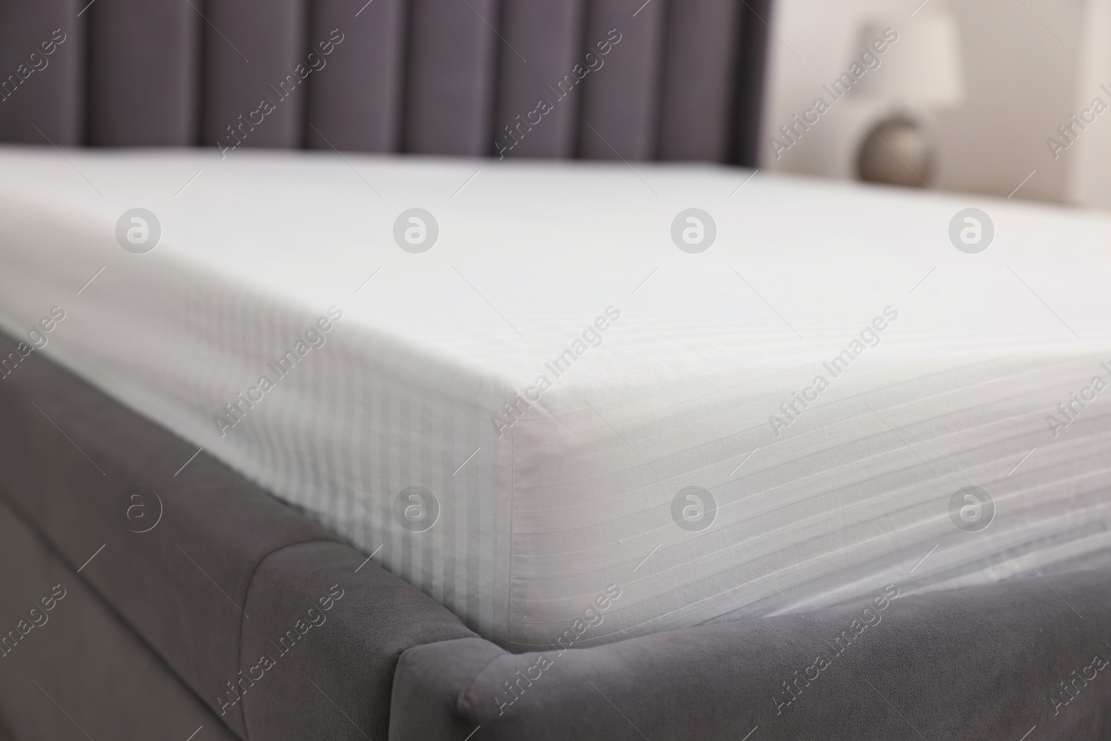 Photo of Bed with clean linens at home, closeup