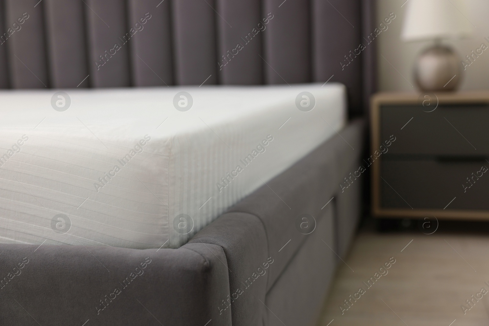 Photo of Bed with clean linens at home, closeup