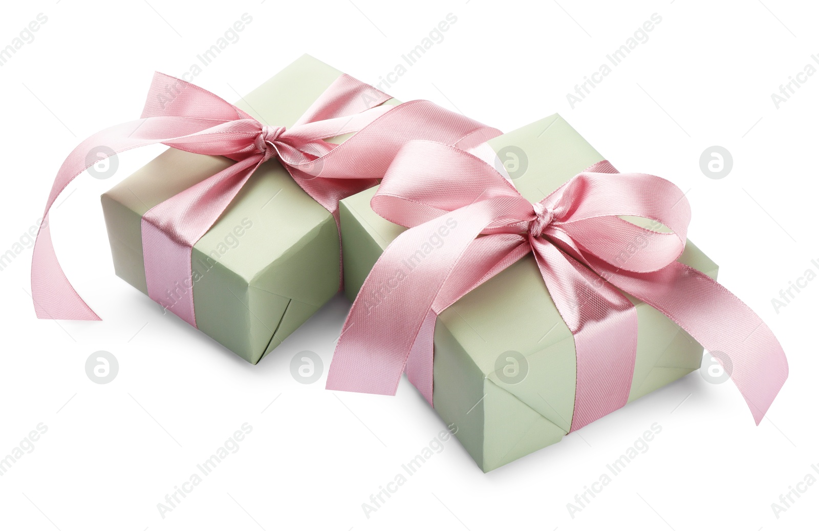 Photo of Beautiful gift boxes with pink bows isolated on white