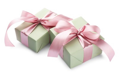 Photo of Beautiful gift boxes with pink bows isolated on white