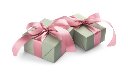 Photo of Beautiful gift boxes with pink bows isolated on white