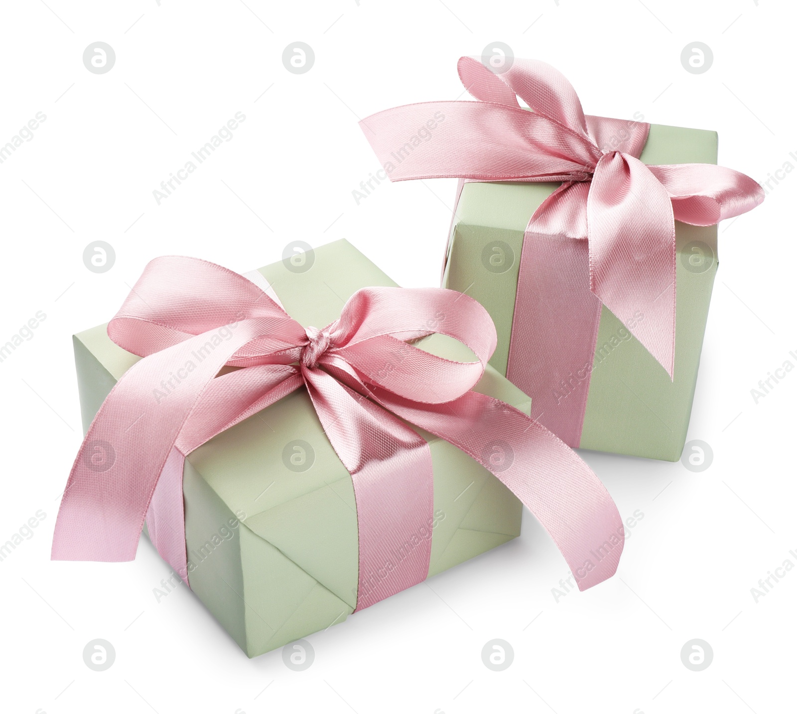 Photo of Beautiful gift boxes with pink bows isolated on white