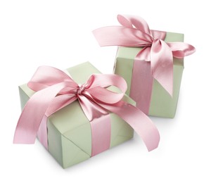 Photo of Beautiful gift boxes with pink bows isolated on white