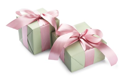 Photo of Beautiful gift boxes with pink bows isolated on white