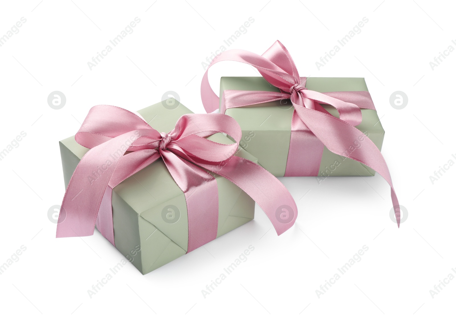 Photo of Beautiful gift boxes with pink bows isolated on white