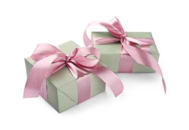 Photo of Beautiful gift boxes with pink bows isolated on white