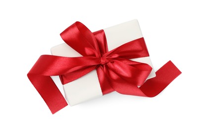 Photo of Beautiful gift box with red bow isolated on white, top view