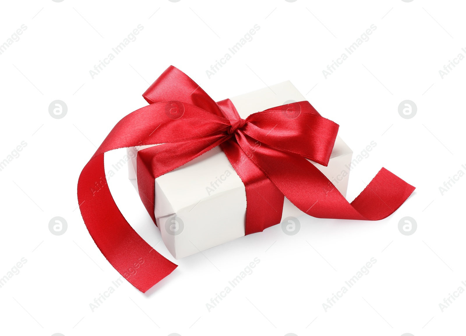 Photo of Beautiful gift box with red bow isolated on white