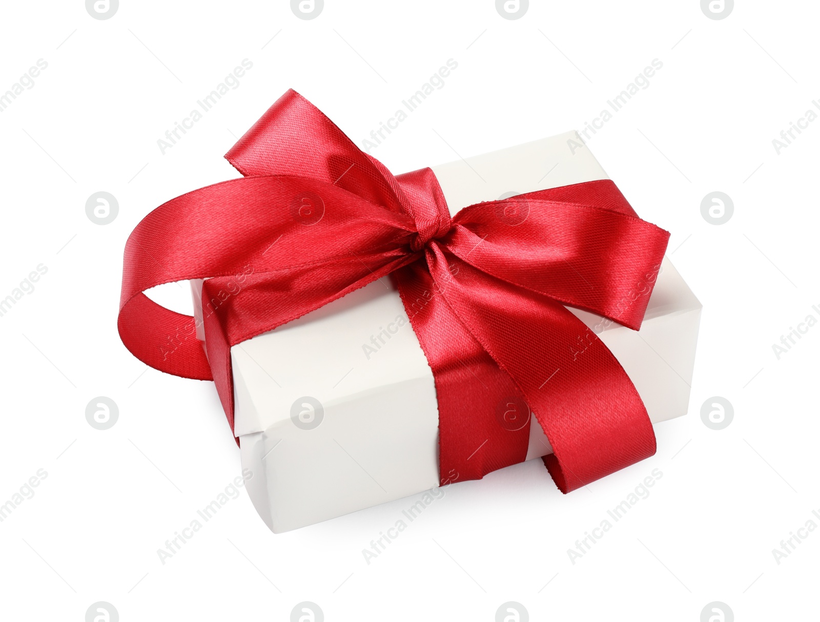 Photo of Beautiful gift box with red bow isolated on white