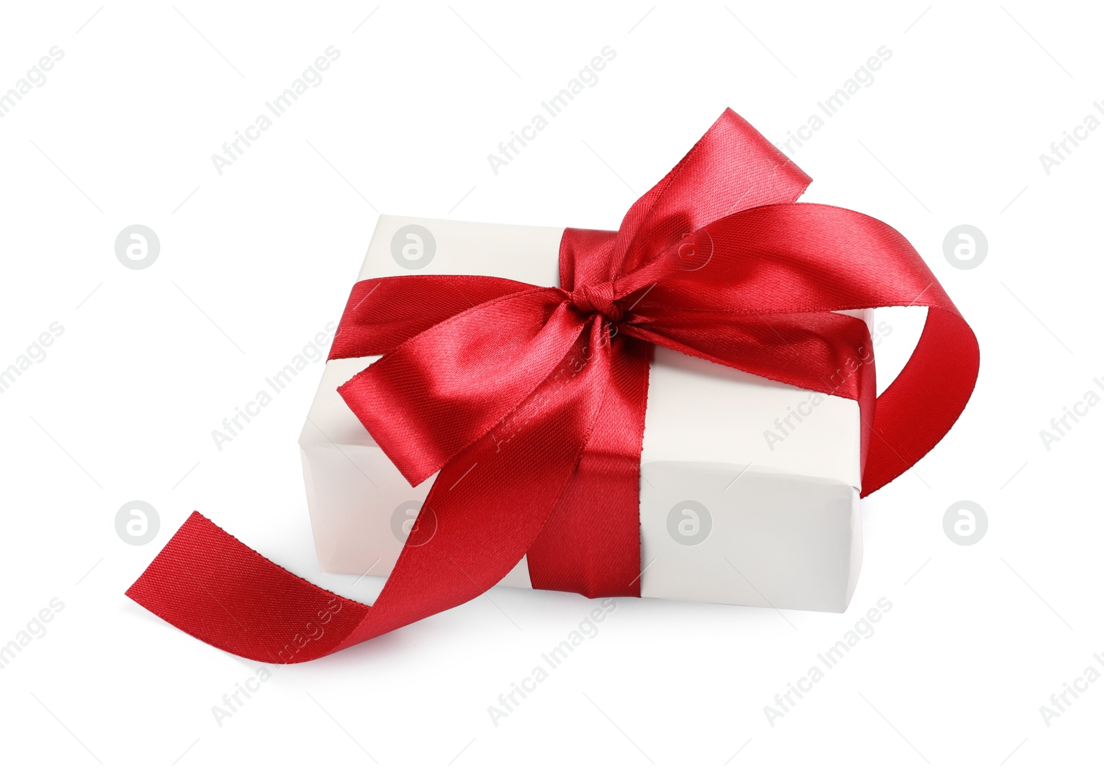 Photo of Beautiful gift box with red bow isolated on white