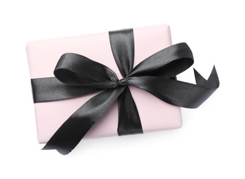 Photo of Beautiful gift box with black bow isolated on white, top view