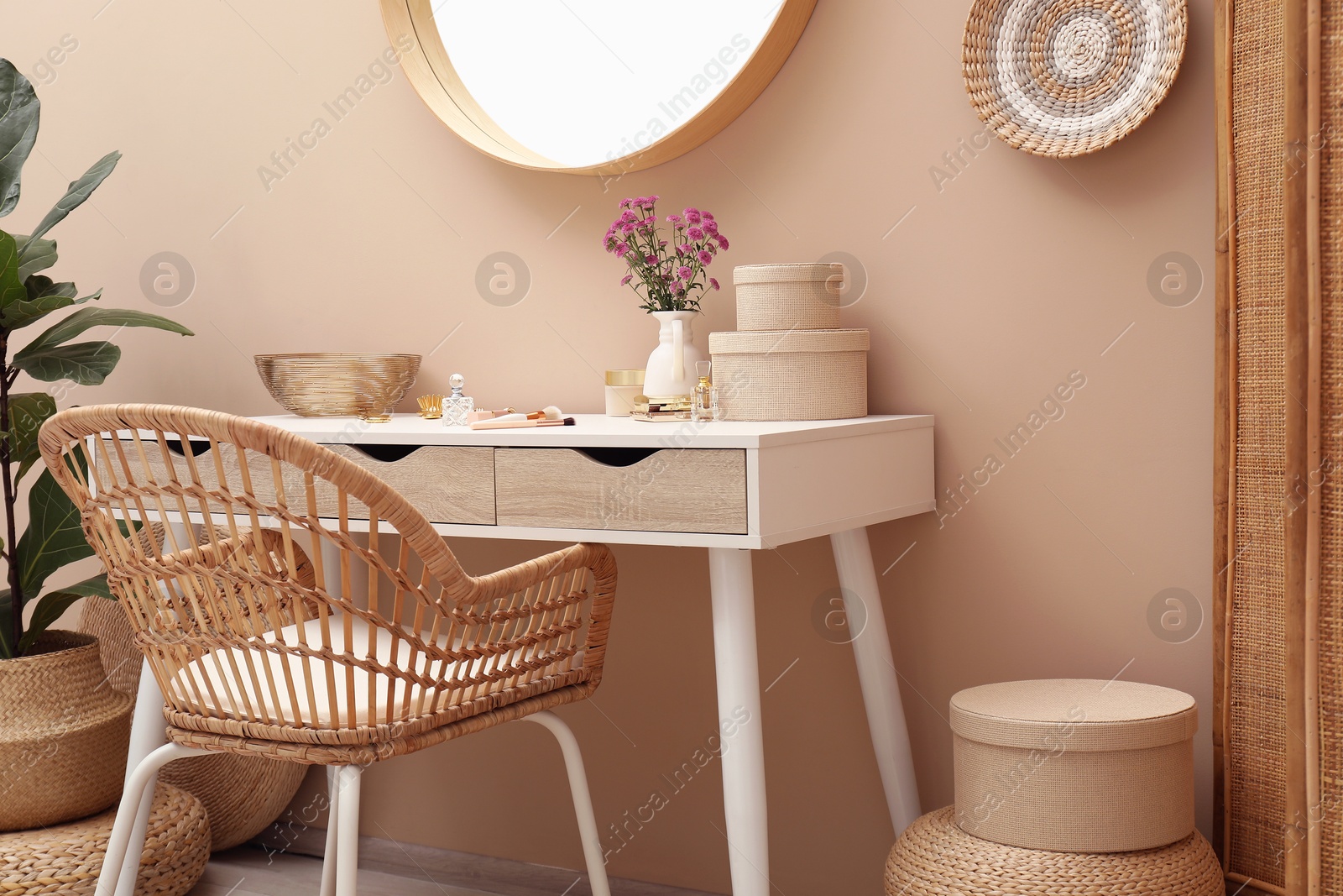 Photo of Stylish dressing table with mirror in room