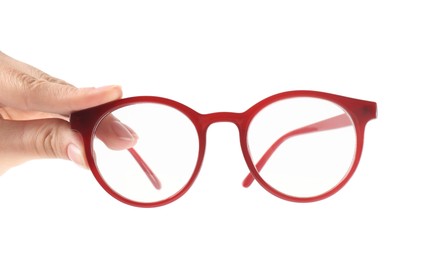 Photo of Woman holding glasses with red frame on white background, closeup