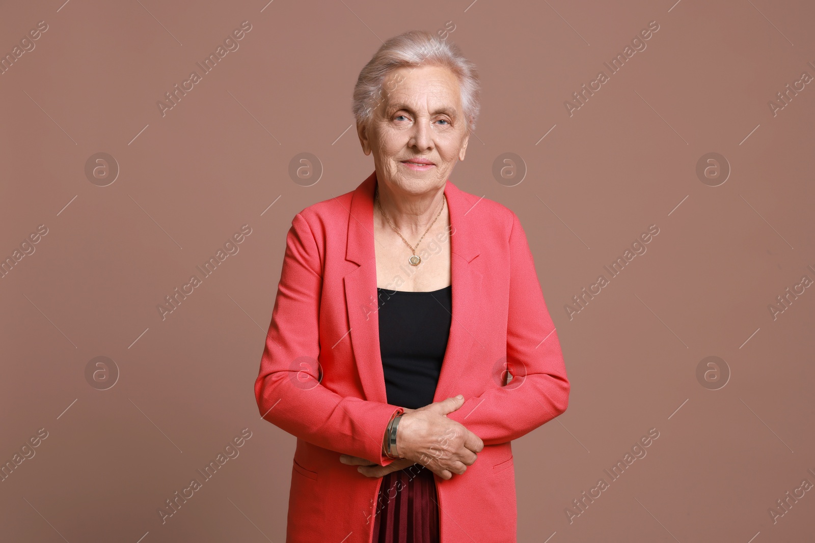 Photo of Portrait of senior woman on color background