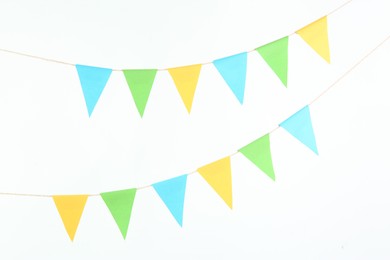 Colorful party flags isolated on white. Festive decor