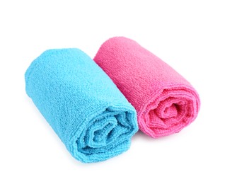 Photo of Clean pink and light blue microfiber cloths isolated on white