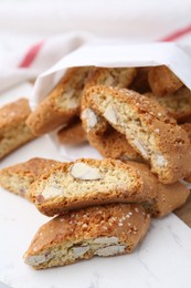 Photo of Traditional Italian almond biscuits (Cantucci) on board, closeup