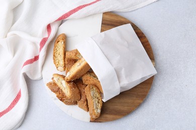 Photo of Traditional Italian almond biscuits (Cantucci) on light table, top view