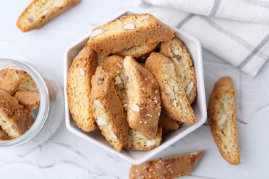 Photo of Traditional Italian almond biscuits (Cantucci) on white table, top view