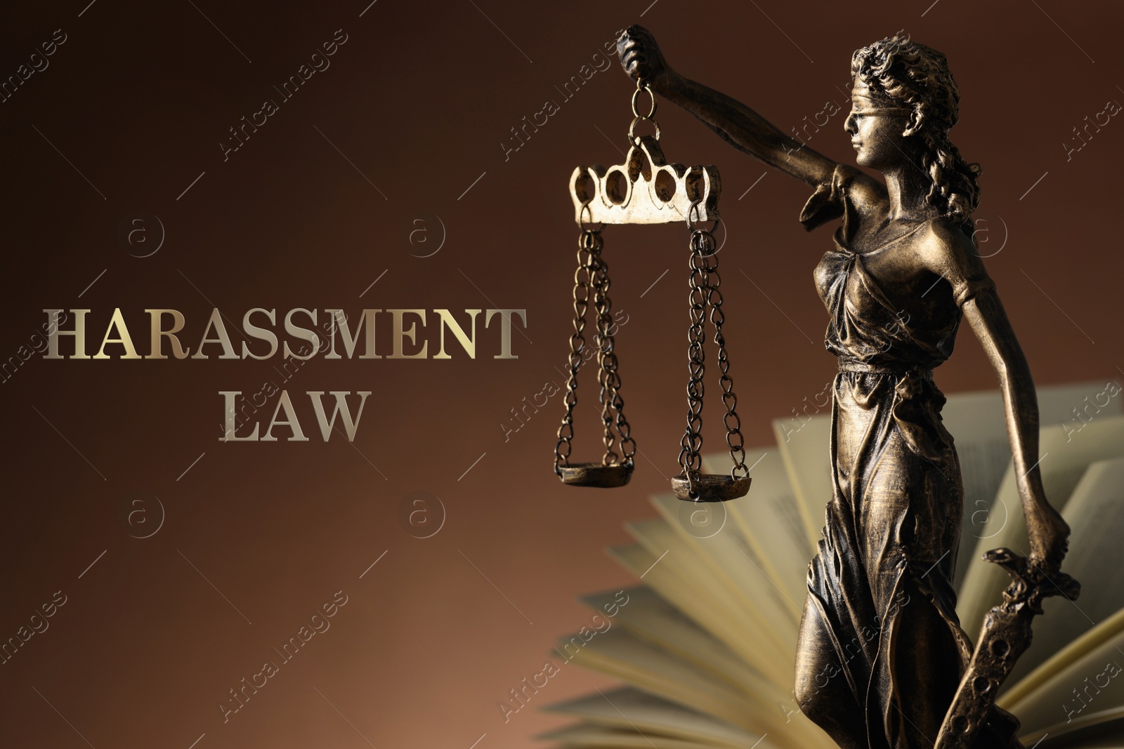 Image of Harassment law. Statue of Lady Justice near book on brown background