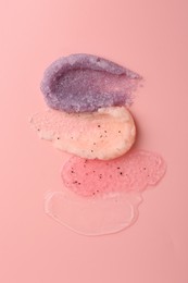 Photo of Samples of cosmetic products on pink background, top view. Skin care