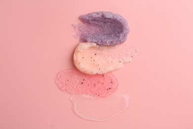 Photo of Samples of cosmetic products on pink background, top view. Skin care