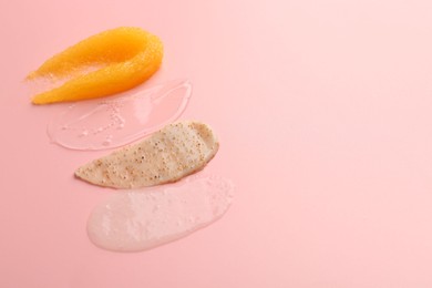 Photo of Samples of cosmetic products on pink background, space for text. Skin care