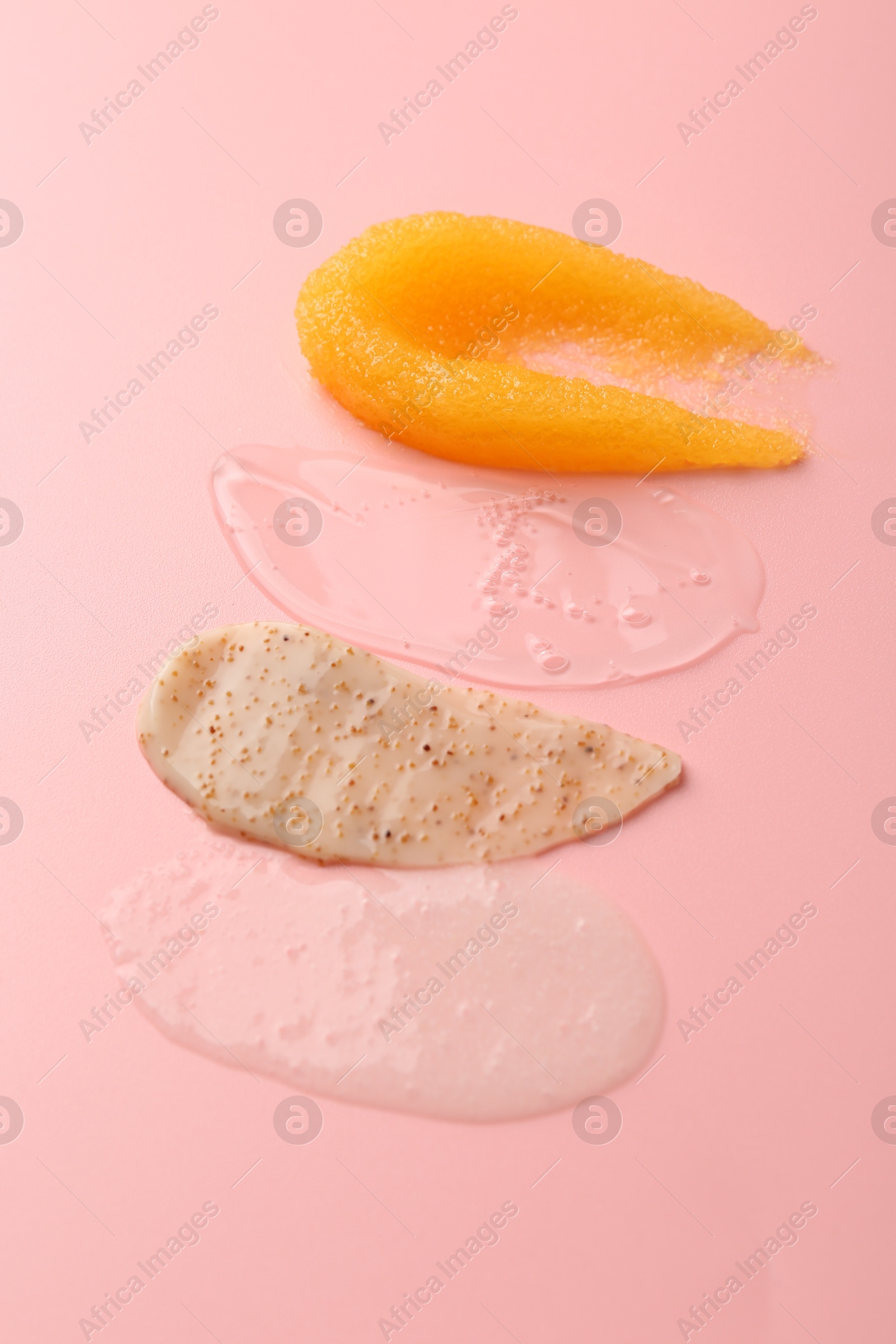 Photo of Samples of cosmetic products on pink background. Skin care