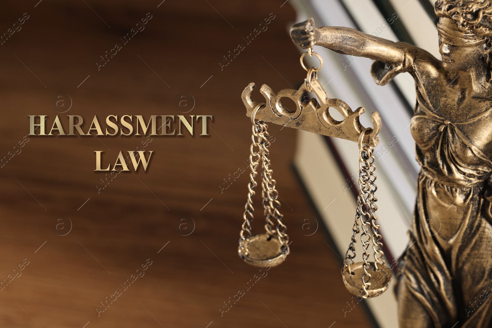 Image of Harassment law. Statue of Lady Justice and books on wooden table