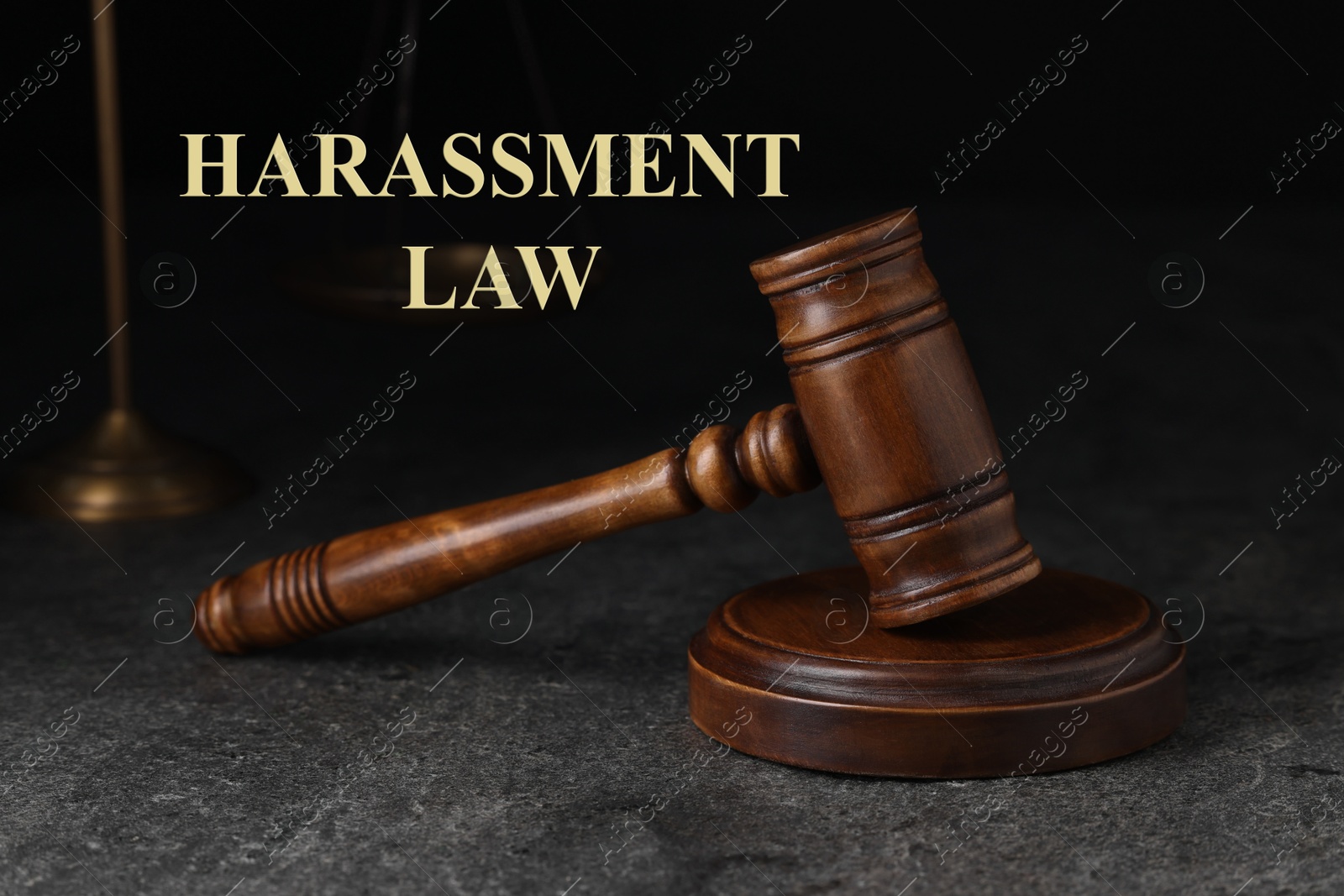 Image of Harassment law. Judge's gavel on grey textured table