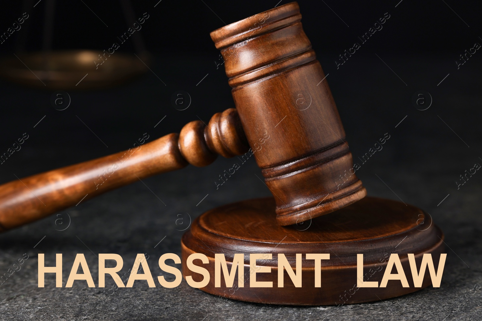 Image of Harassment law. Judge's gavel on grey textured table, closeup