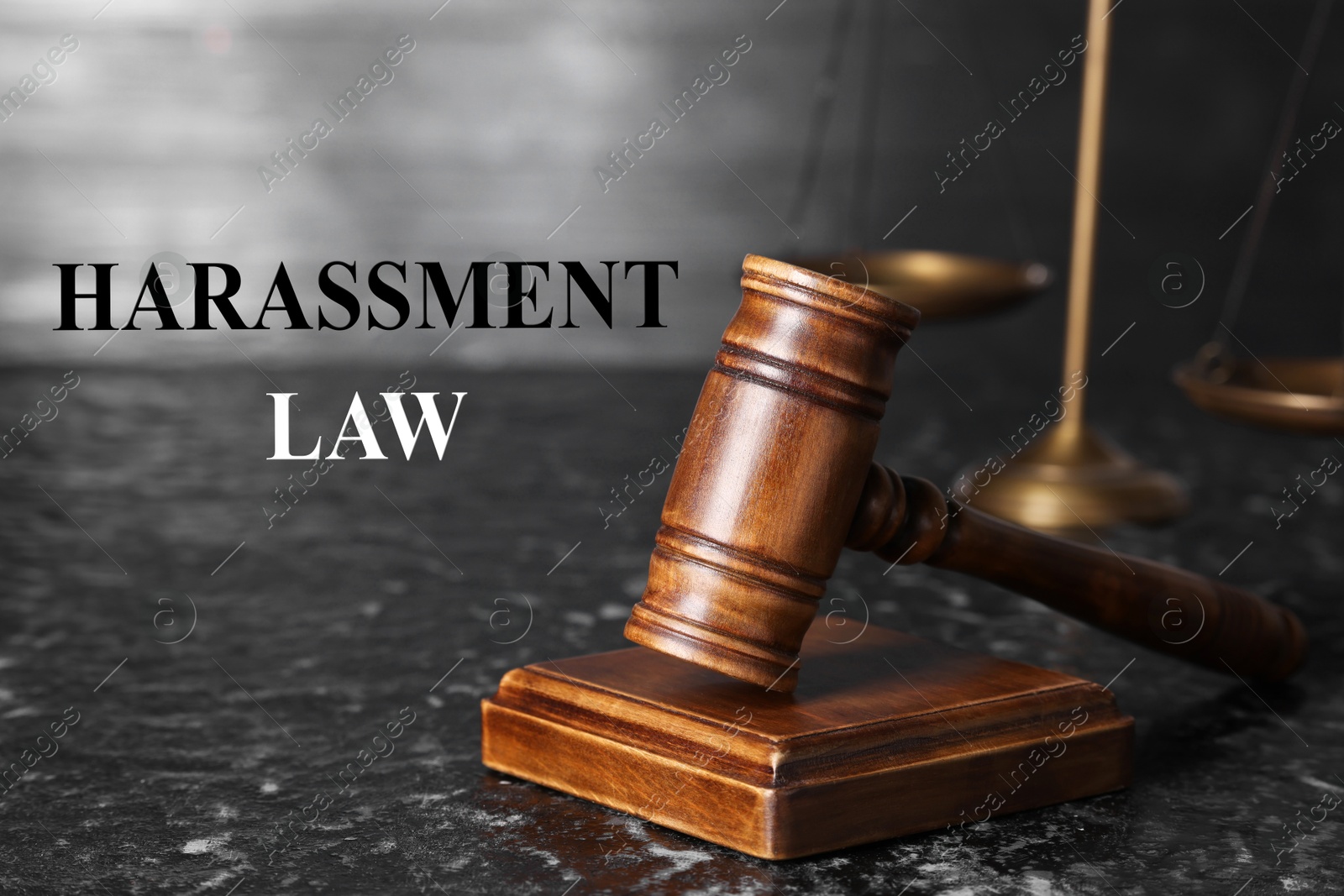 Image of Harassment law. Judge's gavel on dark textured table