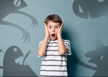 Illustration of Boy scared of monsters, teraphobia. Creepy shadows behind him