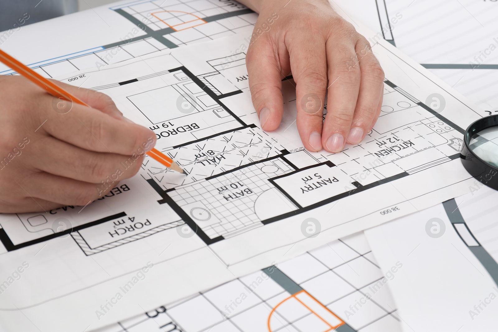 Photo of Architect working with project at table in office, closeup