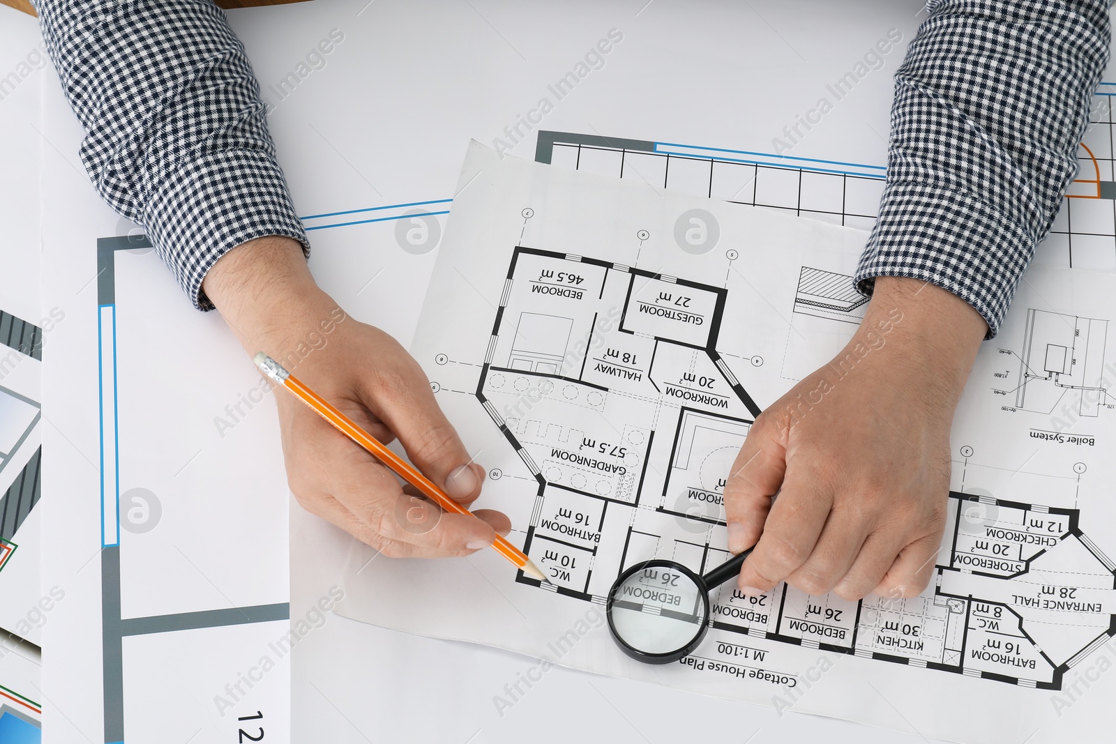 Photo of Architect working with project at table in office, top view