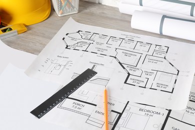 Photo of Different engineering drawings and tools on wooden table