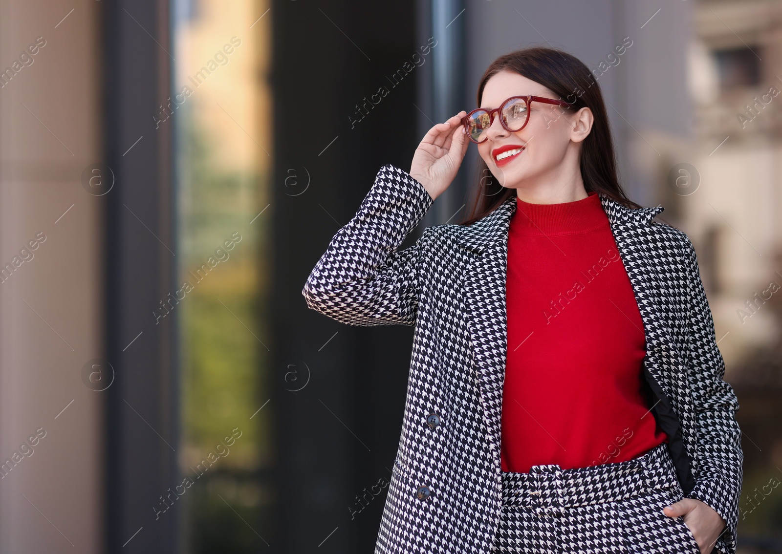 Photo of Beautiful woman in stylish suit outdoors. Space for text