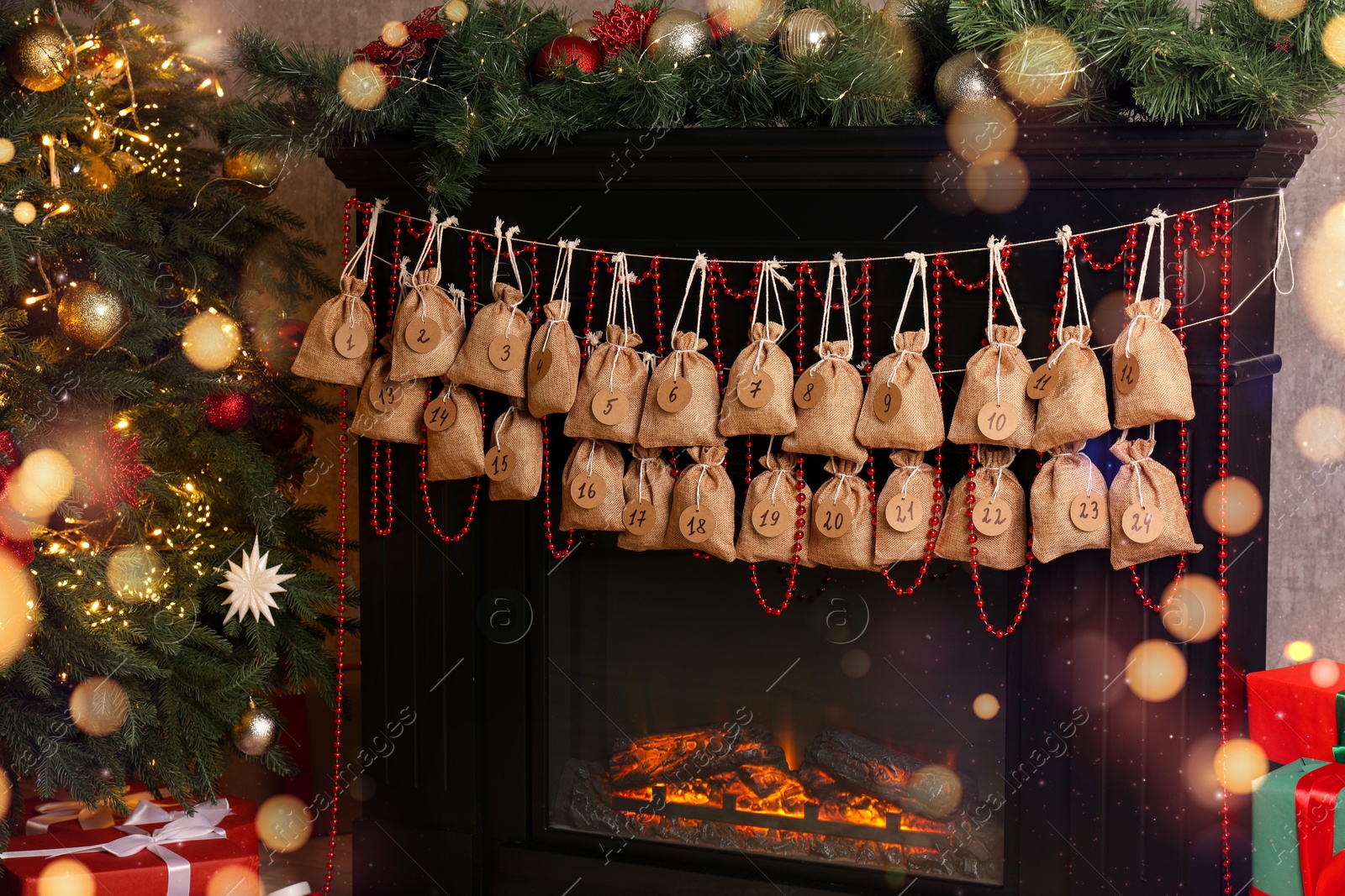 Photo of Advent calendar with gifts and decor hanging on fireplace Christmas near tree indoors