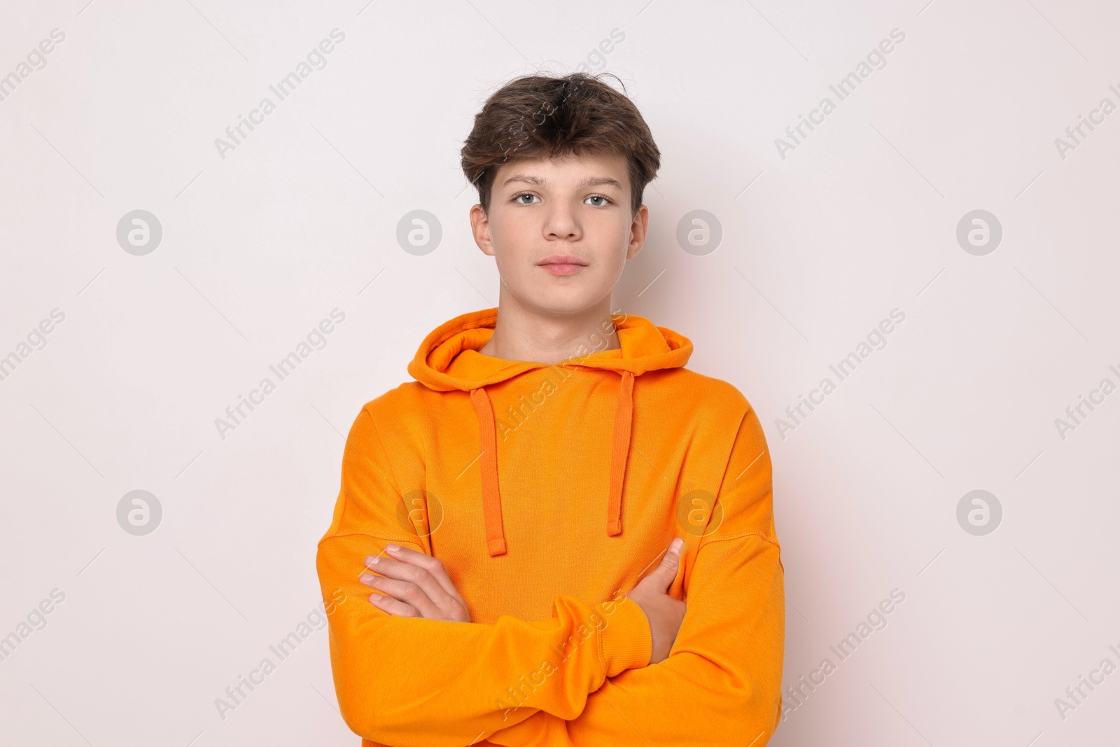 Photo of Portrait of teenage boy on white background