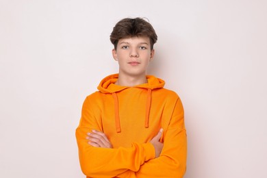 Photo of Portrait of teenage boy on white background