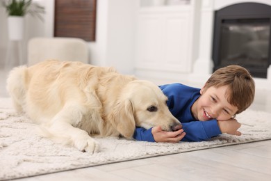 Boy with his cute dog at home