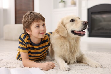 Boy with his cute dog at home