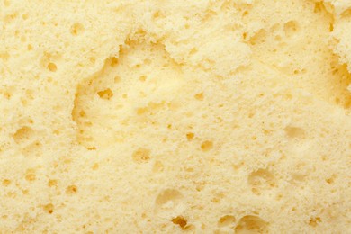 Tasty sponge cake as background, top view