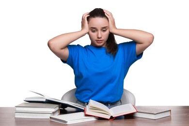 Photo of Young student with books having stress before exam at wooden table isolated on white