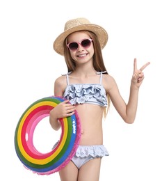 Photo of Little girl in beachwear with inflatable ring on white background