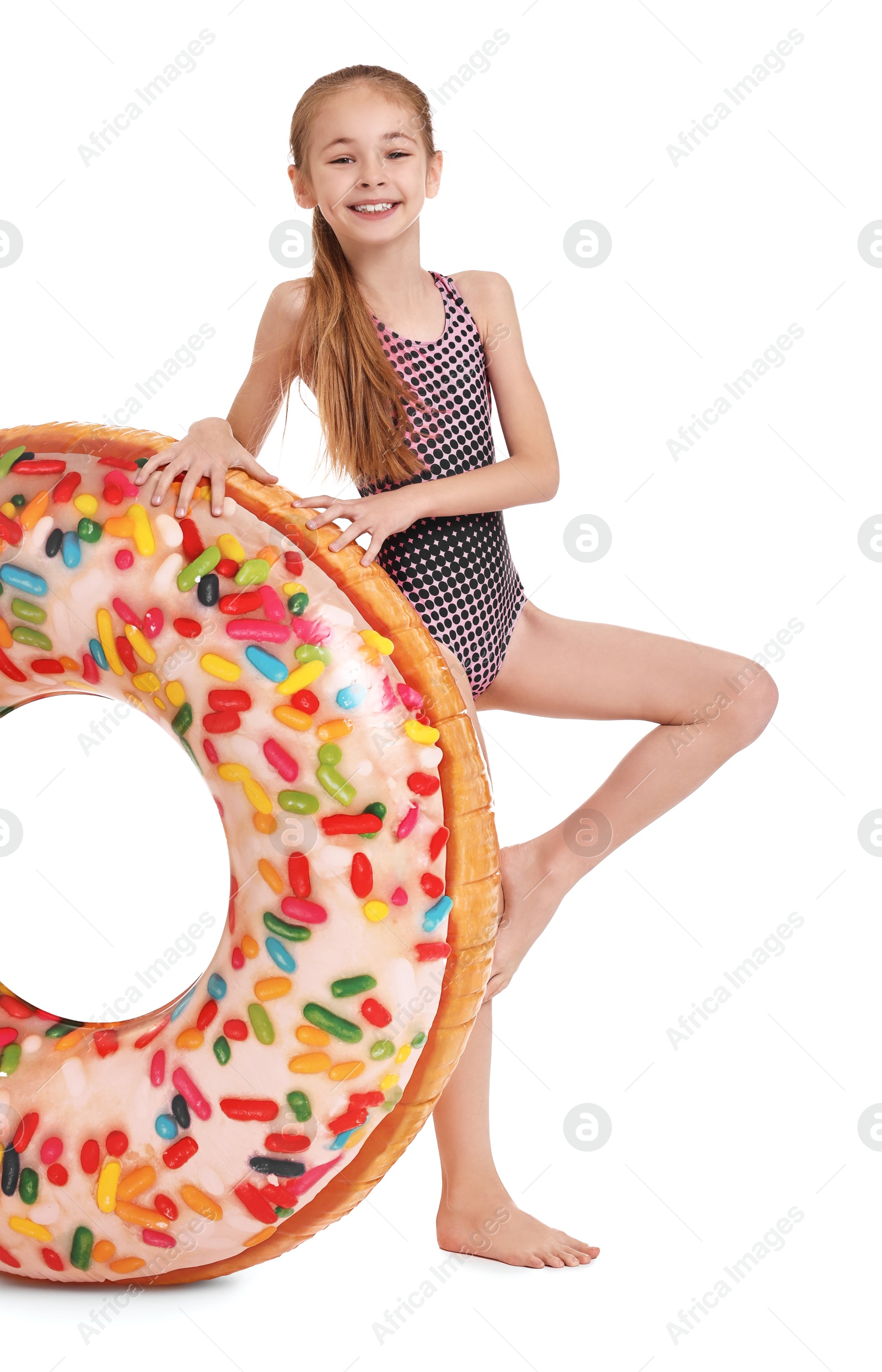 Photo of Happy girl in beachwear with inflatable ring on white background